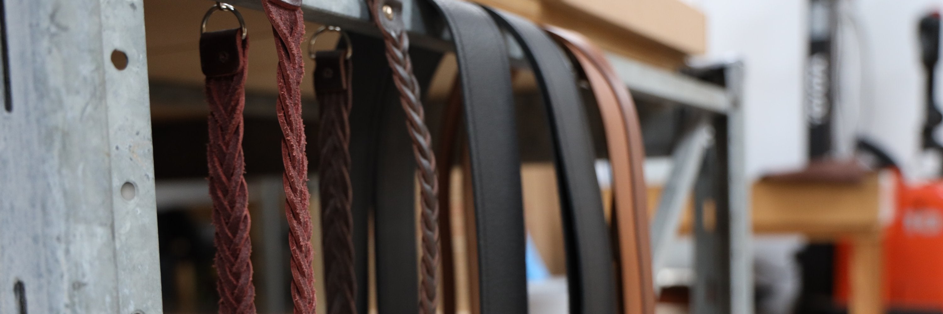 A collection of highland wear belt buckles and straps