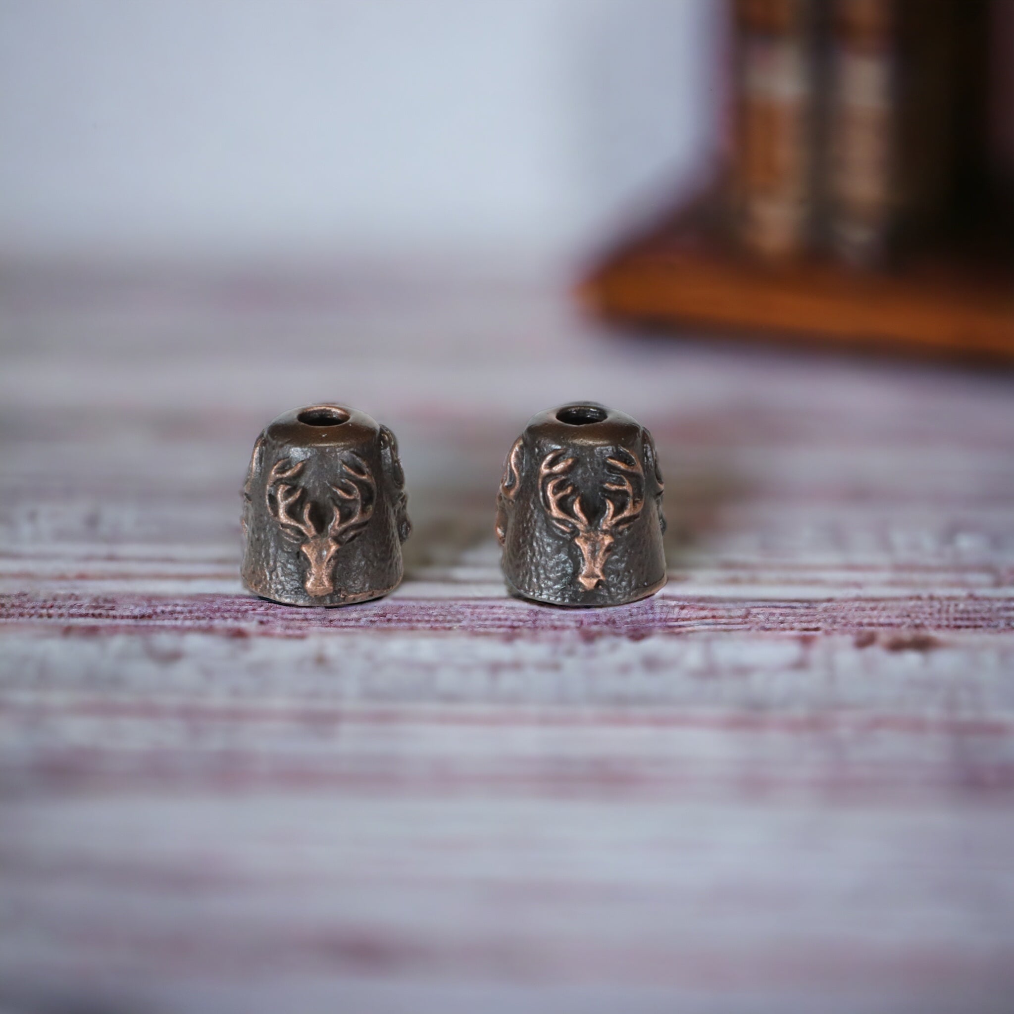 Stags head copper tassel cones