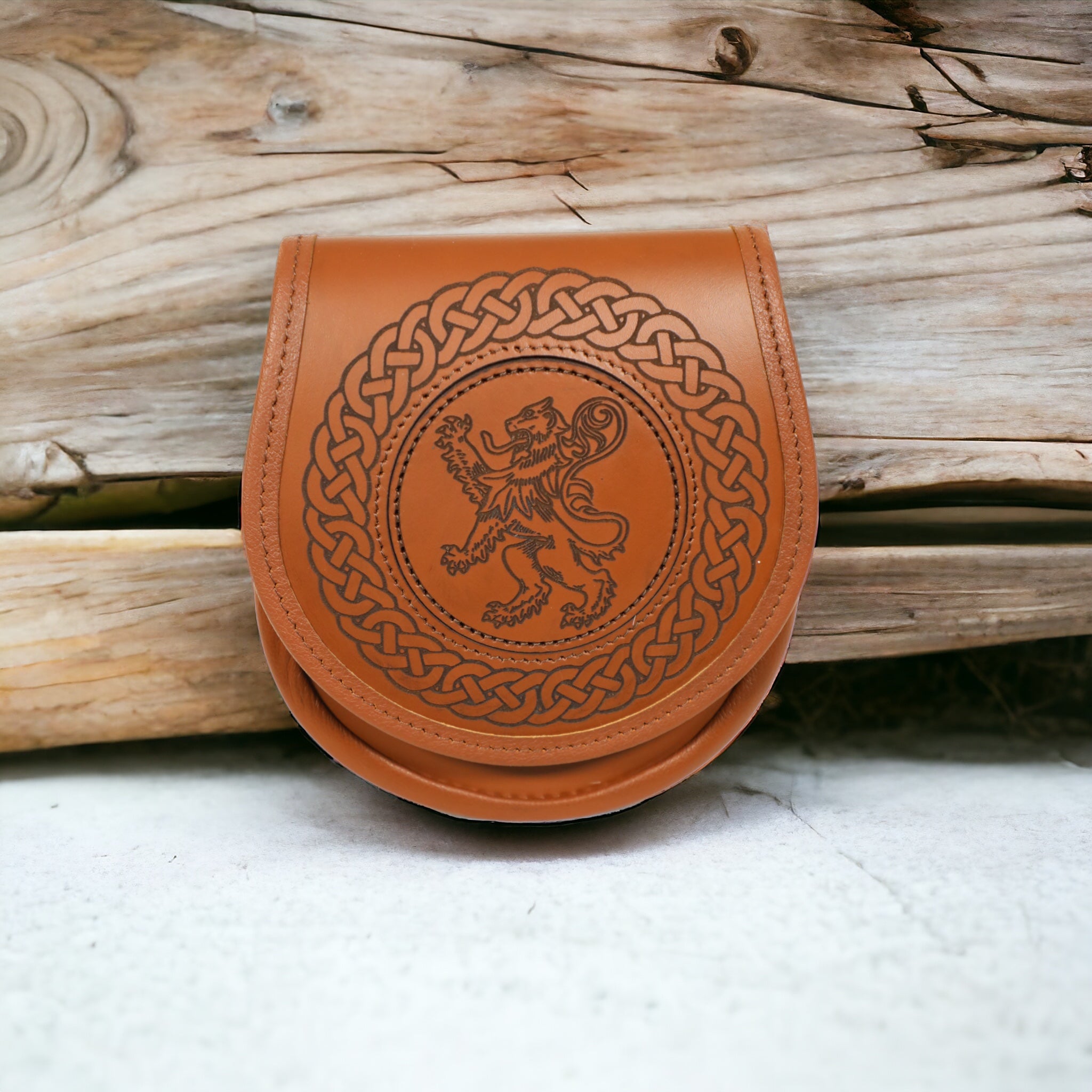 Jacobite all leather sporran with engraved celtic engraving and lion rampant inlay disc  made by Margaret Morrison