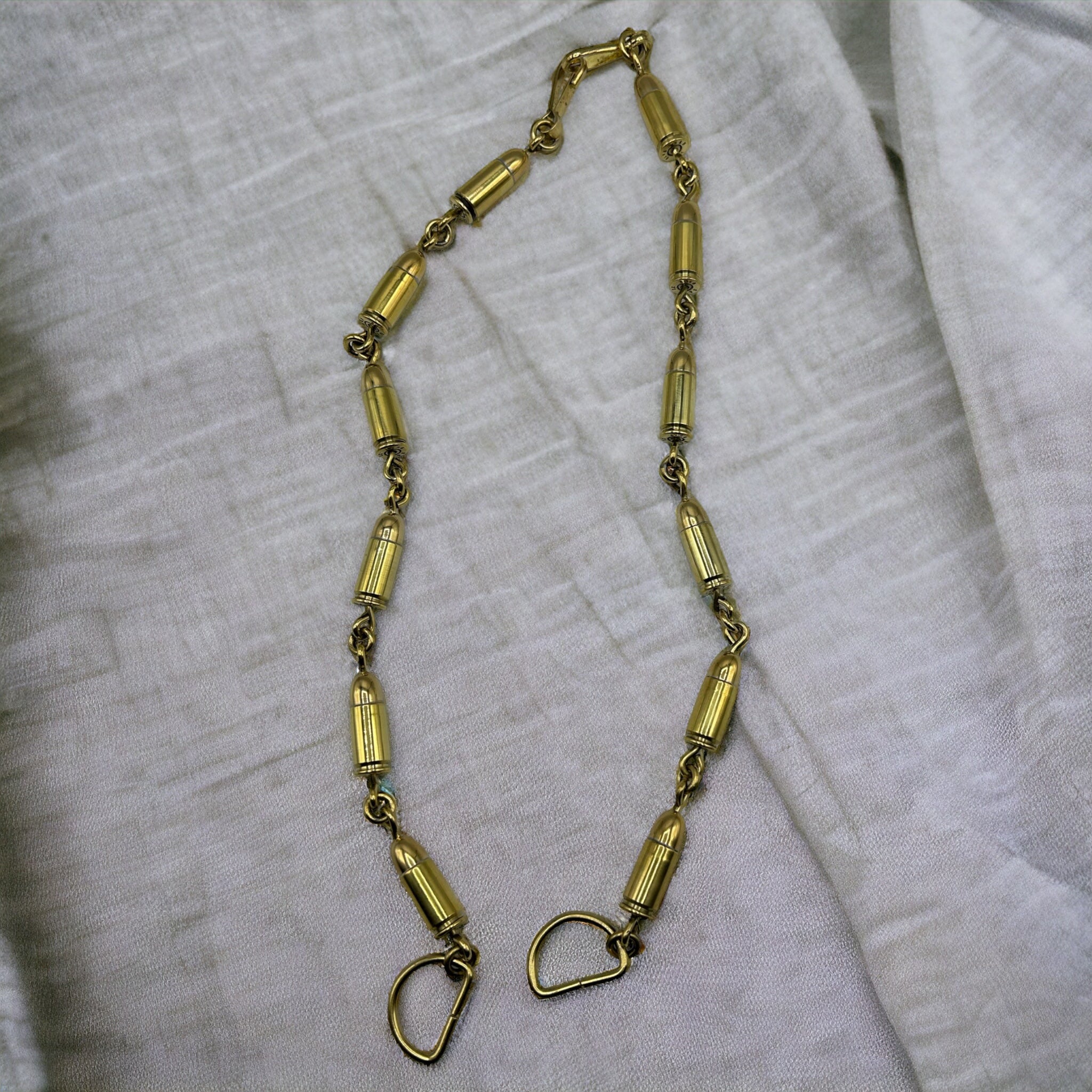 Traditional brass sporran chain made in Scotland using expended amunition.