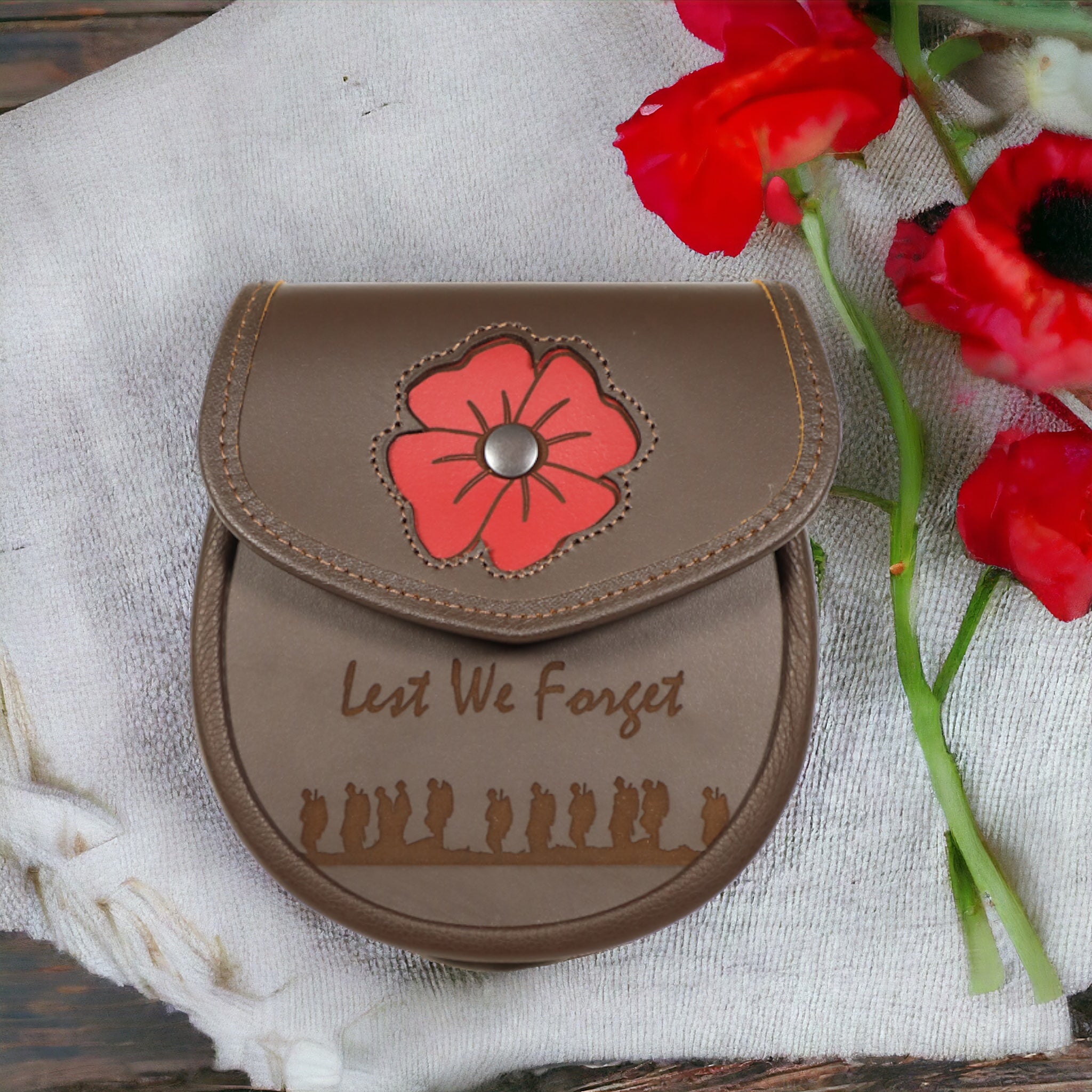 All leather poppy engraved day wear sporran with lest we forget engraving  made by Margaret Morrison