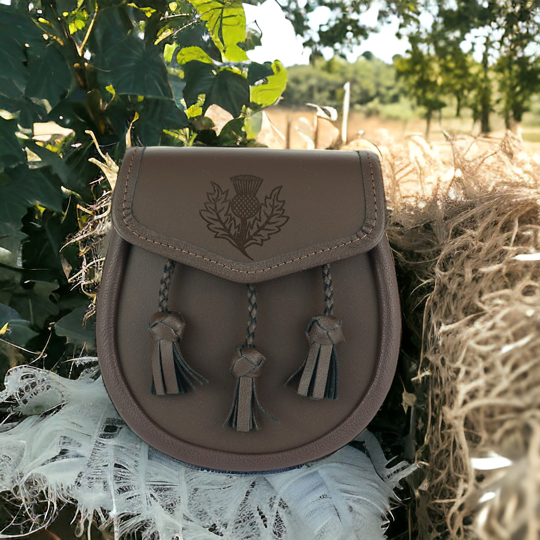 All leather day wear sporran with laser engraved thistle on lid  made by Margaret Morrison