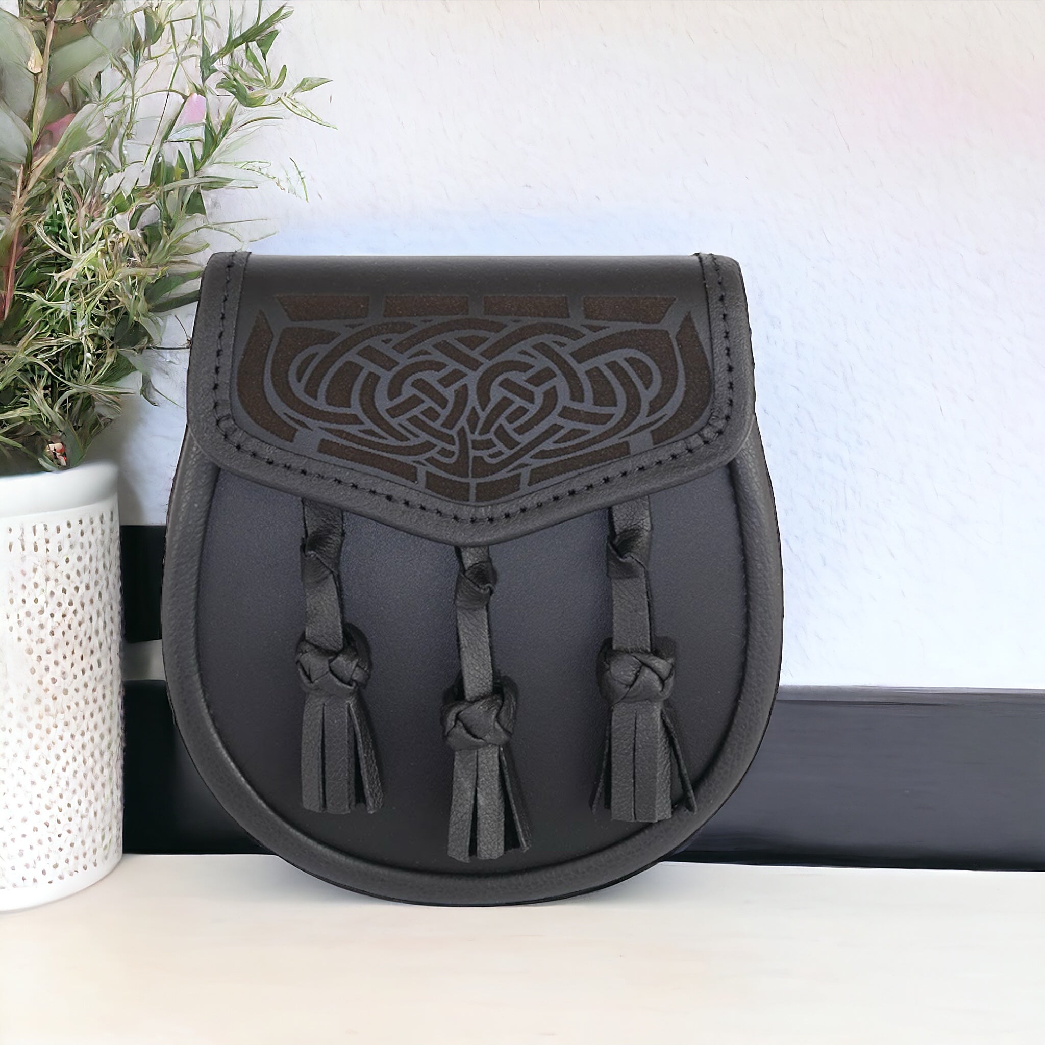 All leather day wear sporran with celtic design laser engraved on lid  made by Margaret Morrison